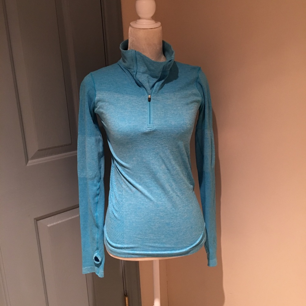 RBX Medium jogging athletic shirt in turquoise.